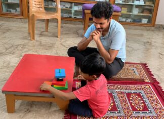 Part 5: Autism Therapies Explained – OT, Speech Therapy, ABA & More Child participating in a structured learning activity with a therapist during an autism therapy session.