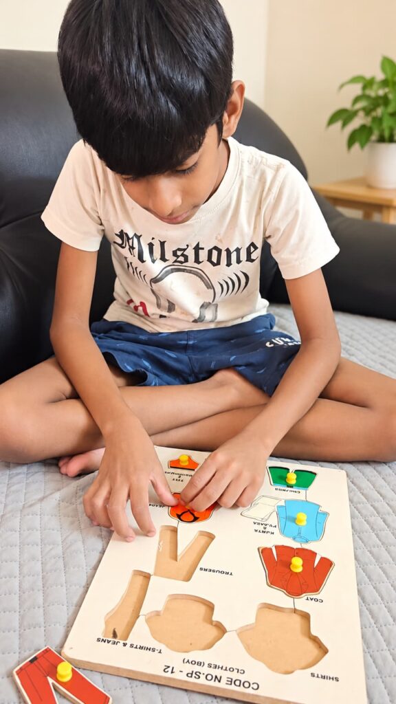 Child completing an educational puzzle during a learning activity at home.