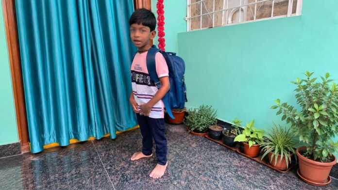 Daily Life with Autism β School Routine Child wearing a school backpack while getting ready for school as part of a daily morning routine at home.