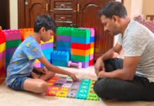 25 Early Autism Signs Parents Should Never Ignore Father sitting with his child during a learning activity at home