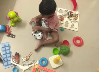 Part 2: Early Signs of Autism in Babies & Toddlers Toddler playing independently with educational toys during early childhood development.