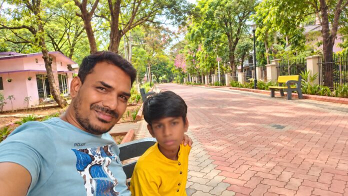 Supporting Yourself While Raising an Autistic Child Parent spending a quiet moment outdoors with their autistic child during an everyday family outing.
